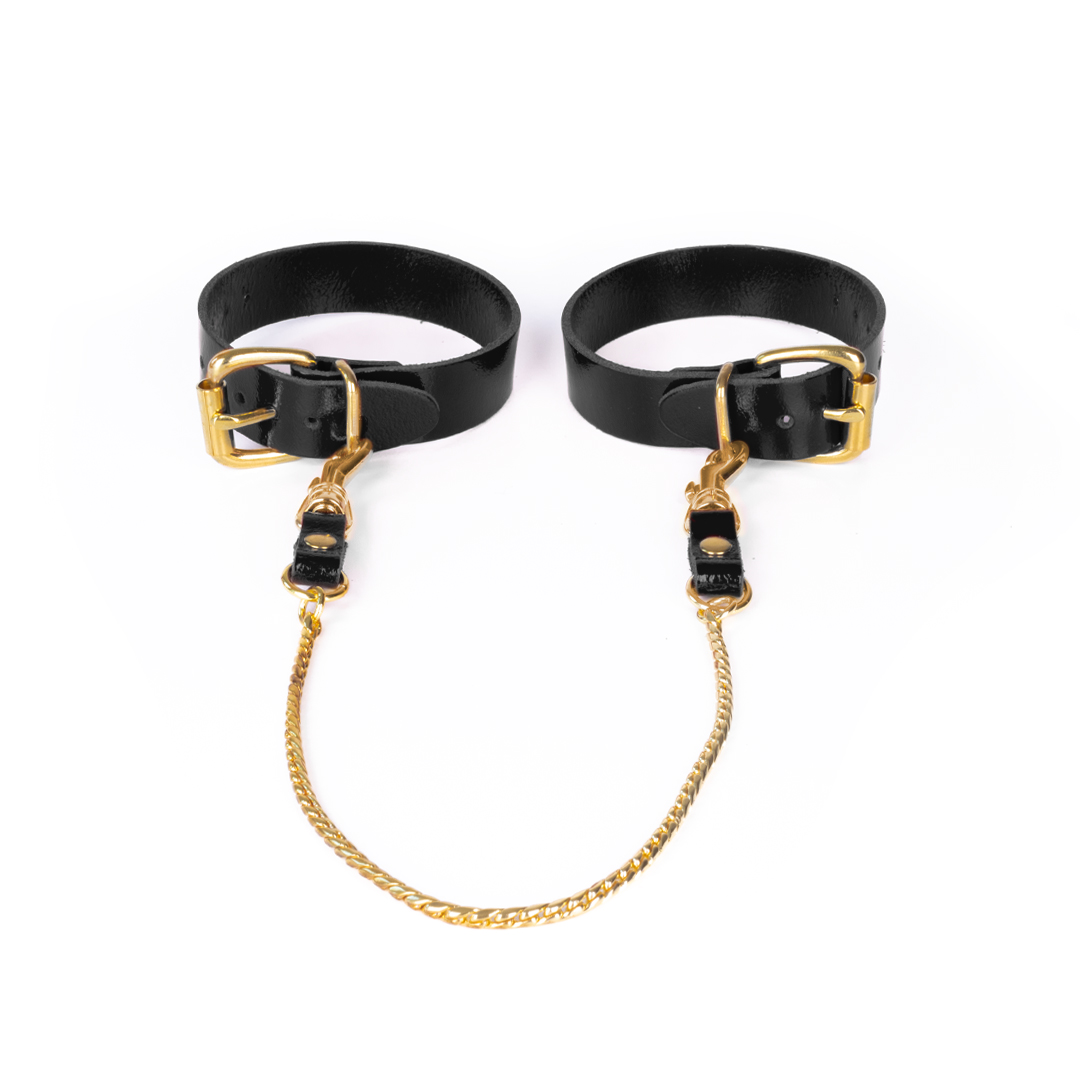 Leder-Fußfesseln mit Kette schwarz/gold