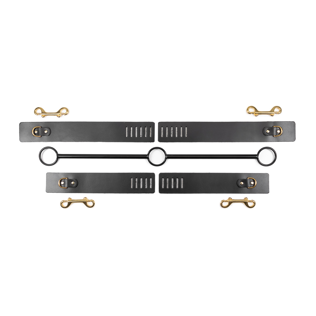 Bar with leather ankle and wrist cuffs black/gold